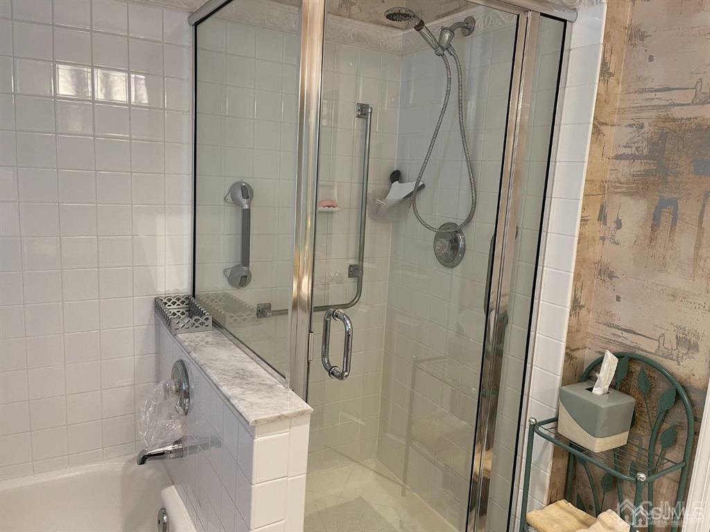 70 A Winthrop Road Monroe Township, NJ 08831 - Photo 34 of 50 a bathroom with a shower and a sink