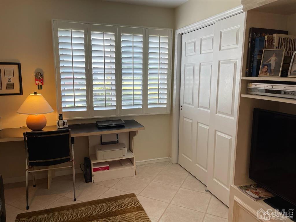 70 A Winthrop Road Monroe Township, NJ 08831 - Photo 38 of 50 a living room with furniture and a flat screen tv
