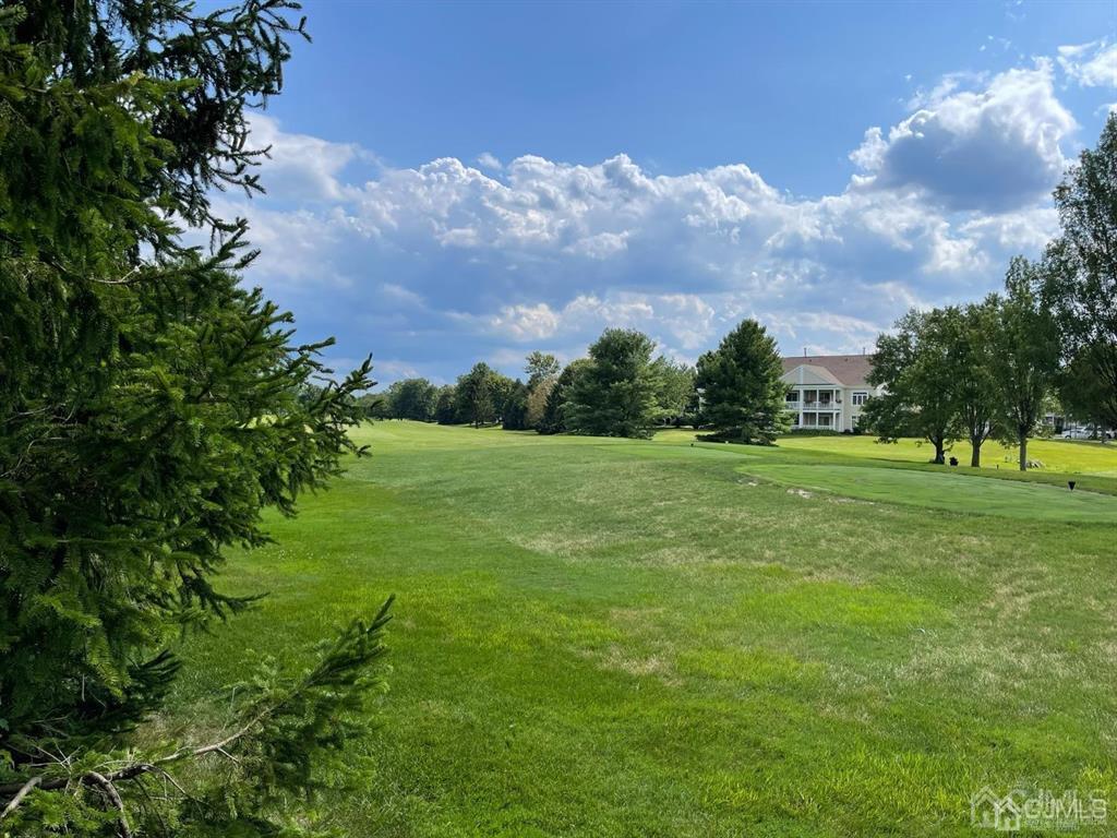 70 A Winthrop Road Monroe Township, NJ 08831 - Photo 4 of 50 a view of a grassy field with trees around