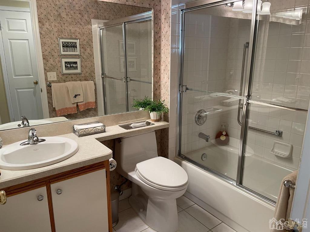 70 A Winthrop Road Monroe Township, NJ 08831 - Photo 42 of 50 a bathroom with a sink a toilet and shower