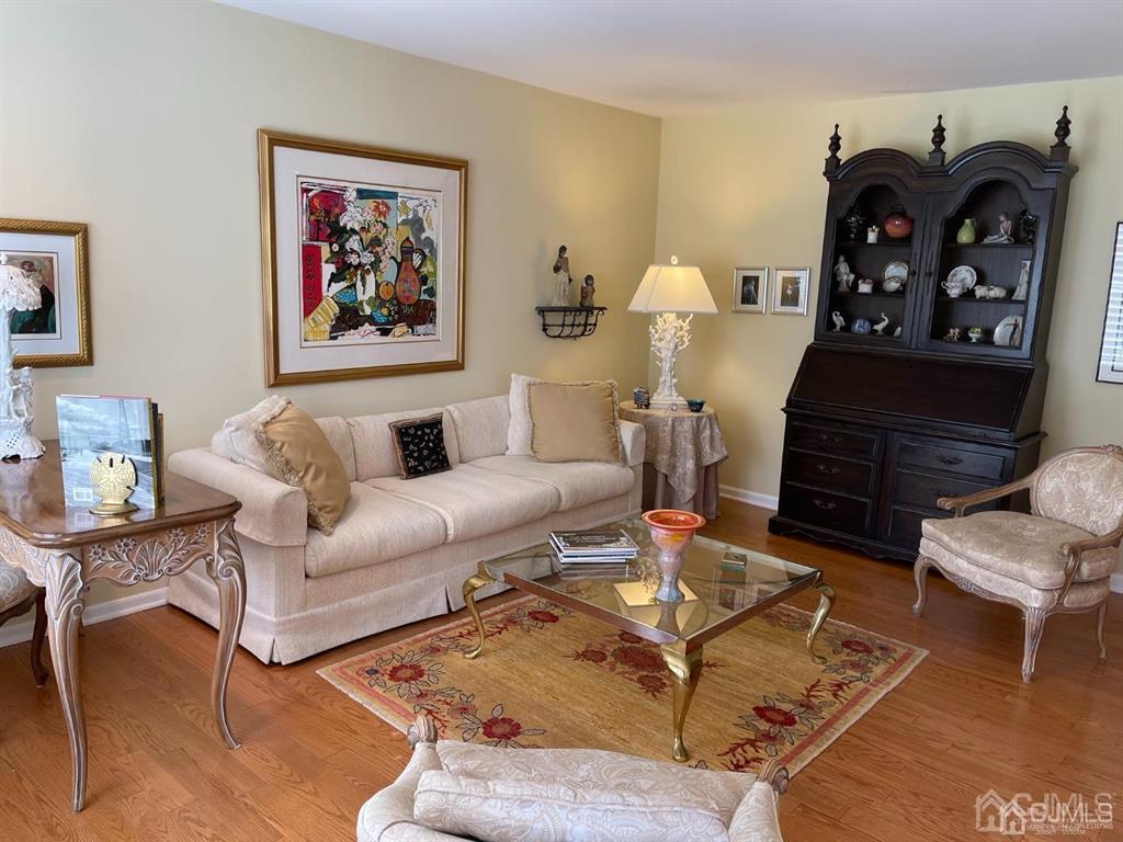 70 A Winthrop Road Monroe Township, NJ 08831 - Photo 8 of 50 a living room with furniture a rug and a fireplace