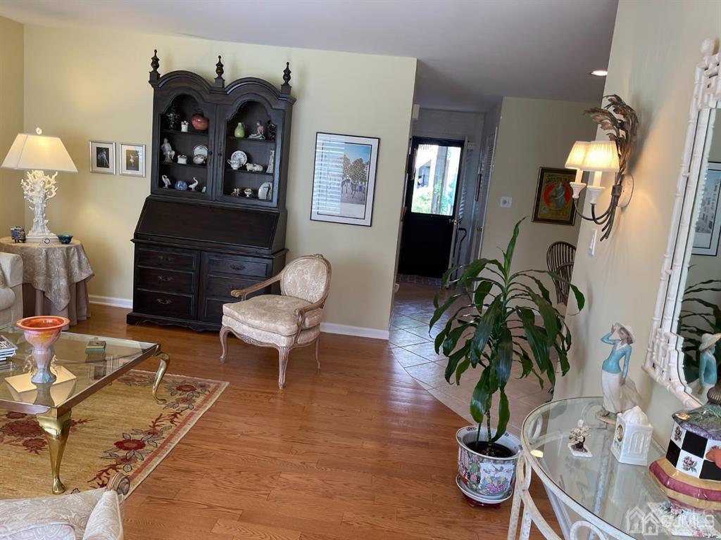 70 A Winthrop Road Monroe Township, NJ 08831 - Photo 9 of 50 a living room with furniture flowers and wooden floor