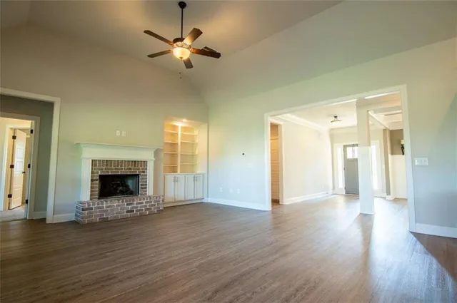 a view of walk in closet with wooden floor
