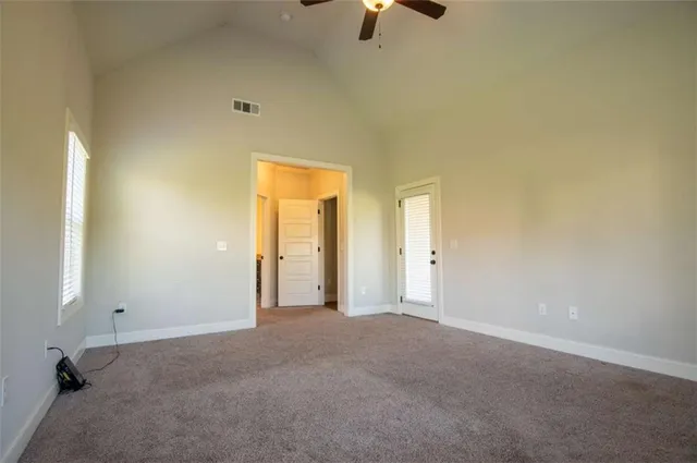 a view of a bathroom with a tub mirror and shower