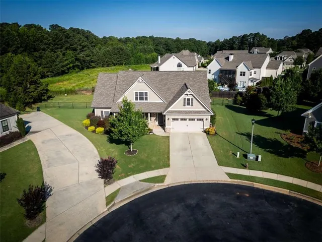 an aerial view of a house with a garden