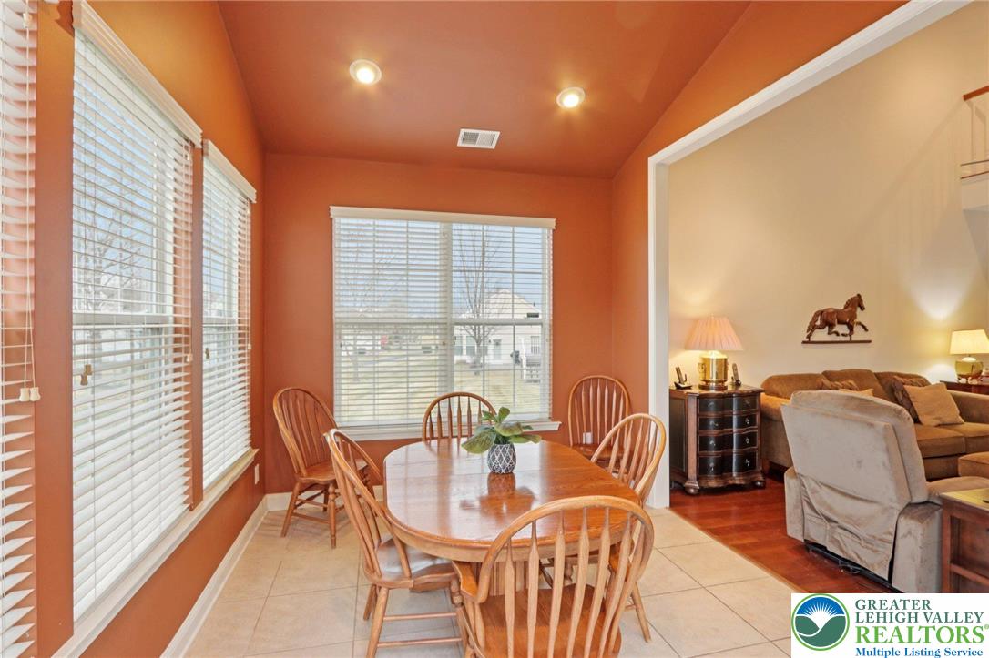 2076 Kingsview Road Lower Macungie Township, PA 18062 - Photo 14 of 53 a dining room with furniture and wooden floor