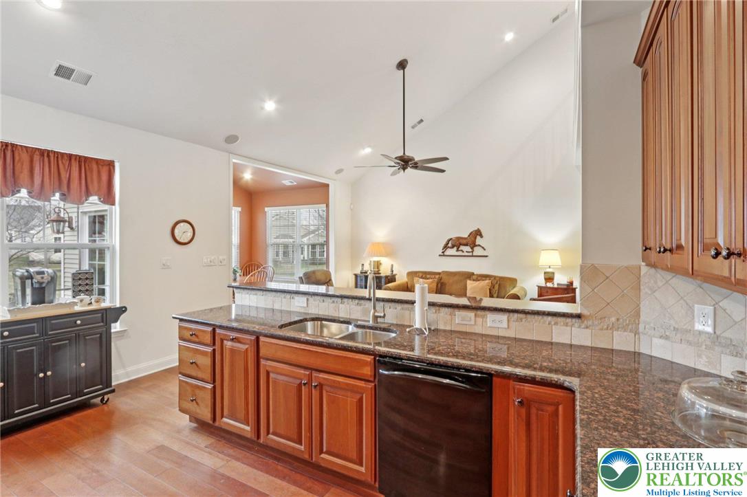 2076 Kingsview Road Lower Macungie Township, PA 18062 - Photo 20 of 53 a kitchen with a sink stove and cabinets