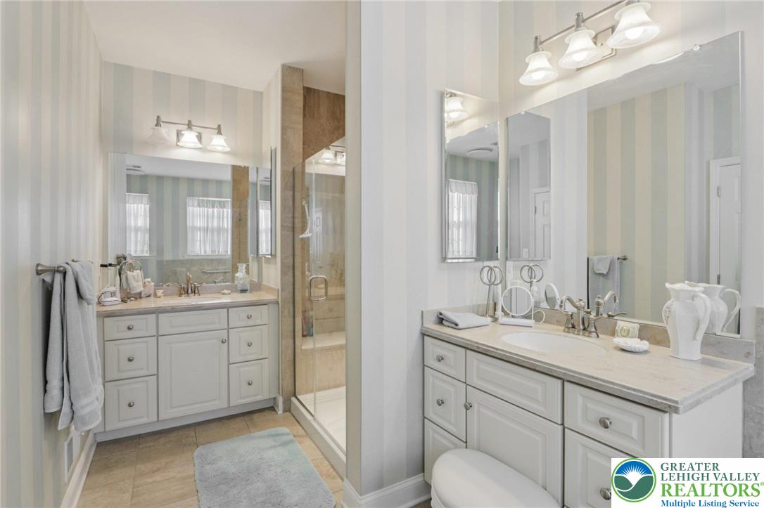 2076 Kingsview Road Lower Macungie Township, PA 18062 - Photo 26 of 53 a bathroom with a sink double vanity and a mirror