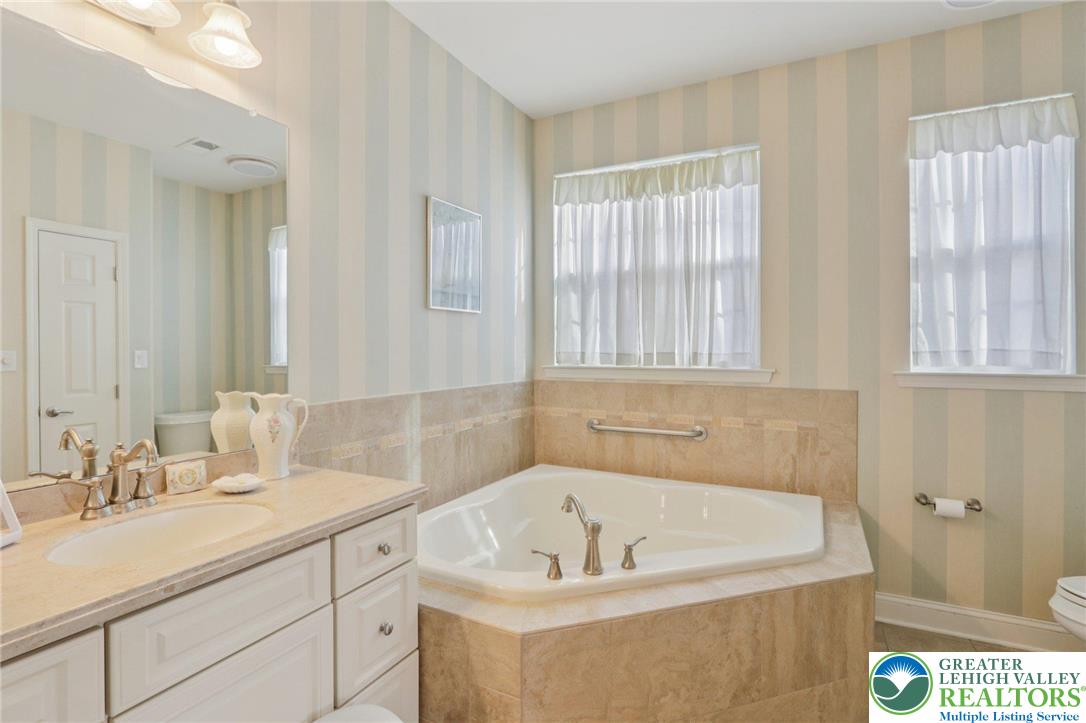 2076 Kingsview Road Lower Macungie Township, PA 18062 - Photo 28 of 53 a bathroom with a sink and a bathtub