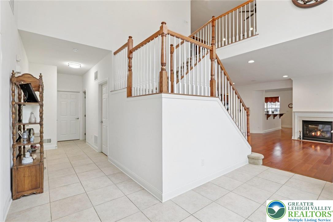 2076 Kingsview Road Lower Macungie Township, PA 18062 - Photo 29 of 53 a view of a hallway with entryway wooden floor and livingroom