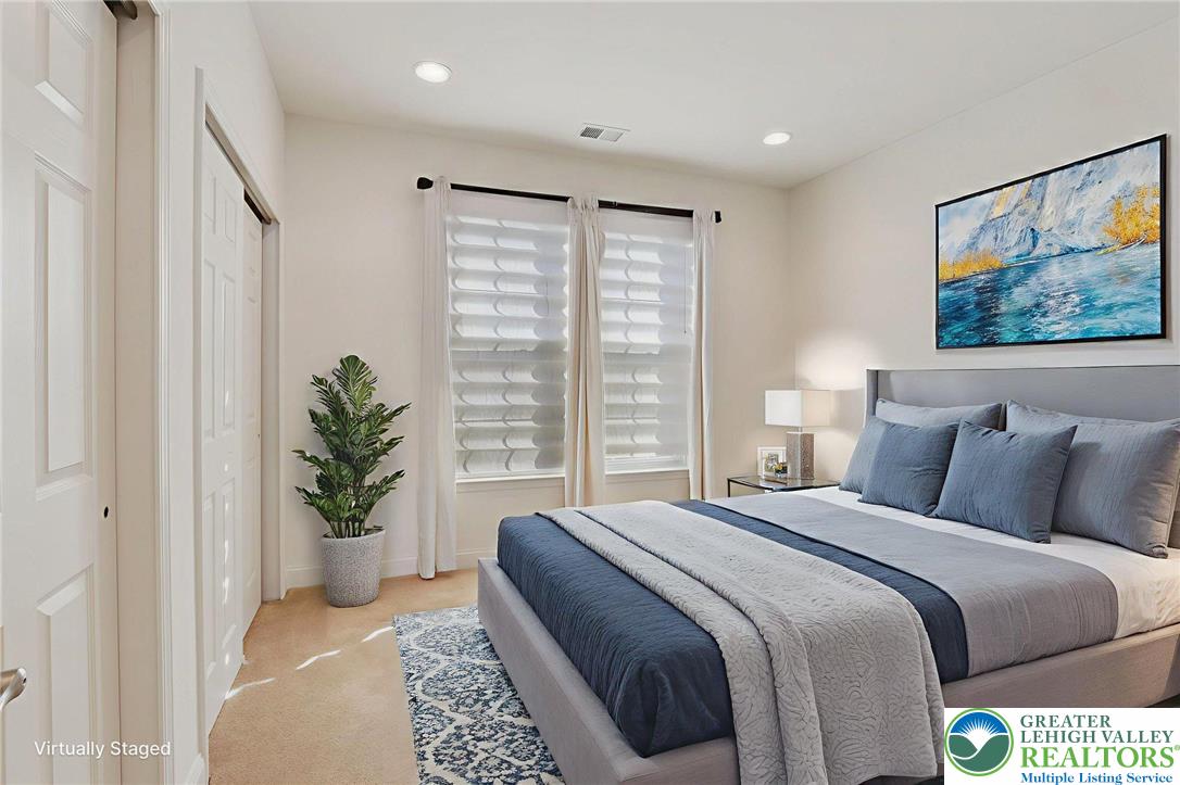 2076 Kingsview Road Lower Macungie Township, PA 18062 - Photo 31 of 53 a bedroom with a large bed and a potted plant