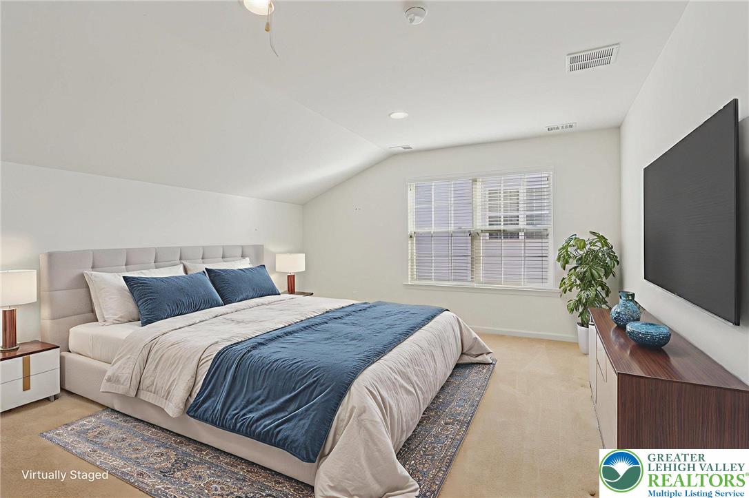 2076 Kingsview Road Lower Macungie Township, PA 18062 - Photo 36 of 53 a bedroom with a large bed and a flat tv screen on dresser