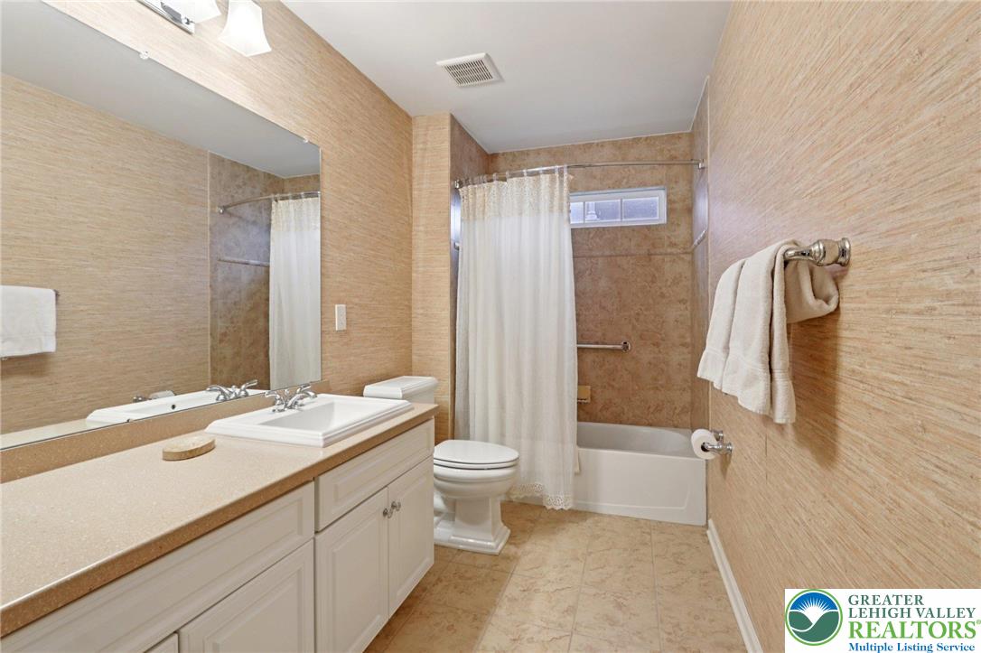 2076 Kingsview Road Lower Macungie Township, PA 18062 - Photo 38 of 53 a bathroom with a sink a toilet and shower