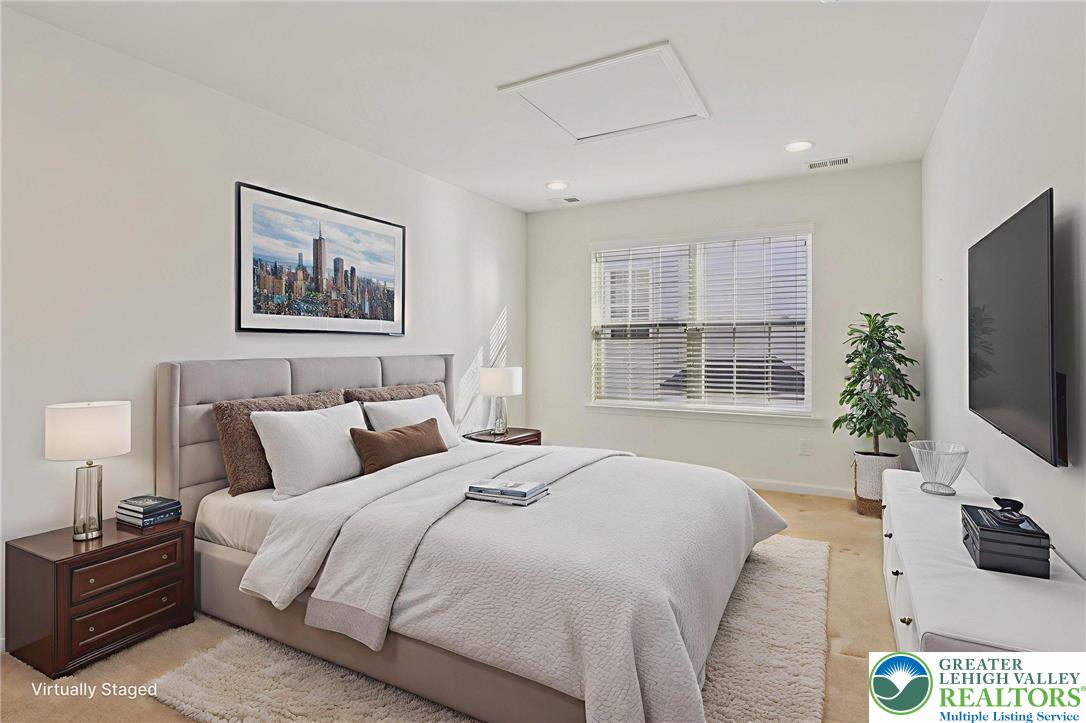 2076 Kingsview Road Lower Macungie Township, PA 18062 - Photo 39 of 53 a bedroom with a large bed and a flat screen tv