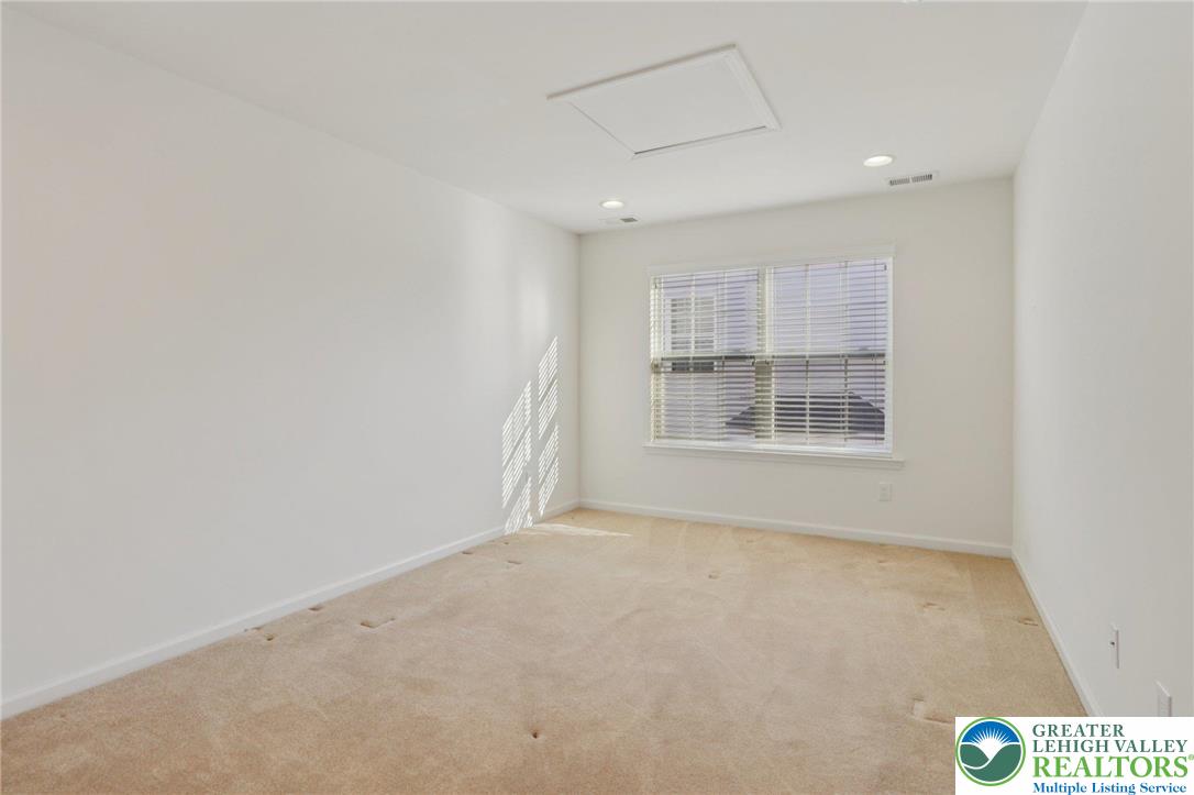 2076 Kingsview Road Lower Macungie Township, PA 18062 - Photo 40 of 53 a view of an empty room with a window