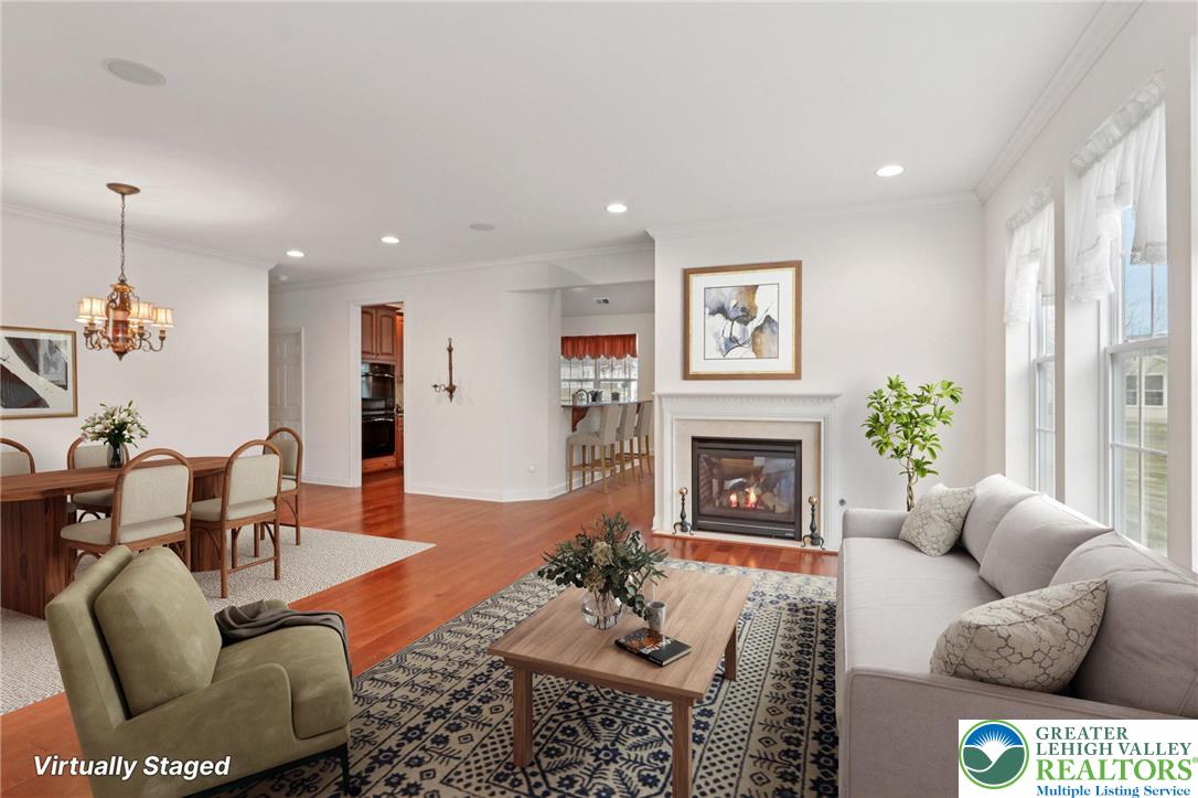 2076 Kingsview Road Lower Macungie Township, PA 18062 - Photo 4 of 53 a living room with furniture a fireplace and a large window