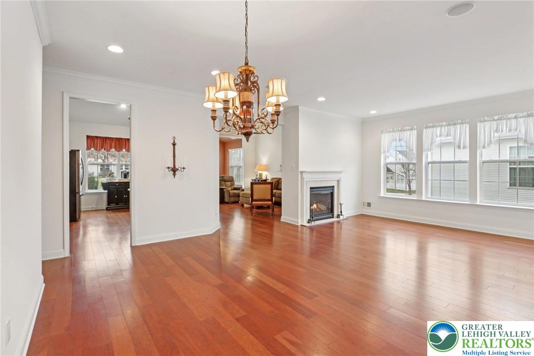 2076 Kingsview Road Lower Macungie Township, PA 18062 - Photo 5 of 53 a view of a room with wooden floor fireplace and windows