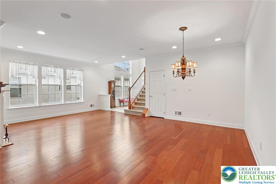 2076 Kingsview Road Lower Macungie Township, PA 18062 - Photo 7 of 53 a view of an empty room with wooden floor and a window