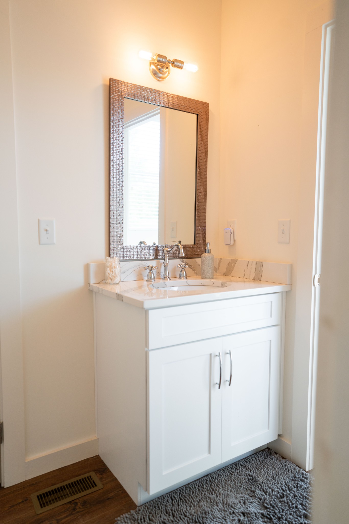 421 Eastside Road Burns, TN 37029 - Photo 29 of 39 a bathroom with a sink a vanity and a mirror
