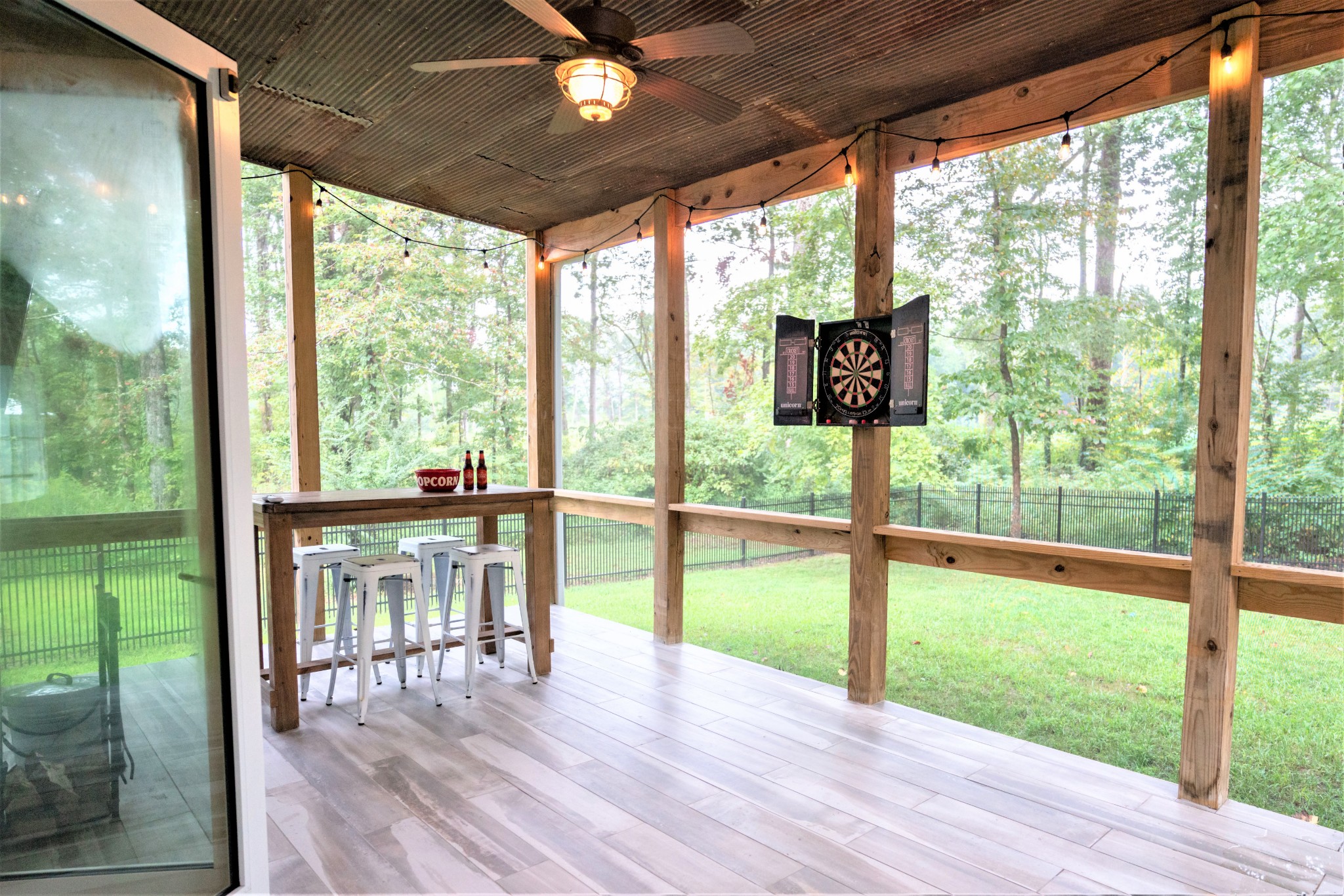 421 Eastside Road Burns, TN 37029 - Photo 35 of 39 a view of a porch with furniture and wooden floor