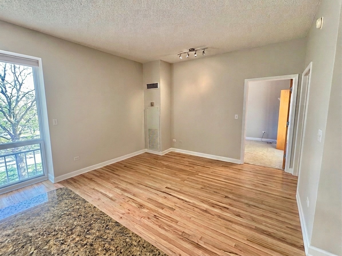 41 East 8th Street, Unit 1805 Chicago, IL 60605 - Photo 11 of 33 a view of empty room with wooden floor