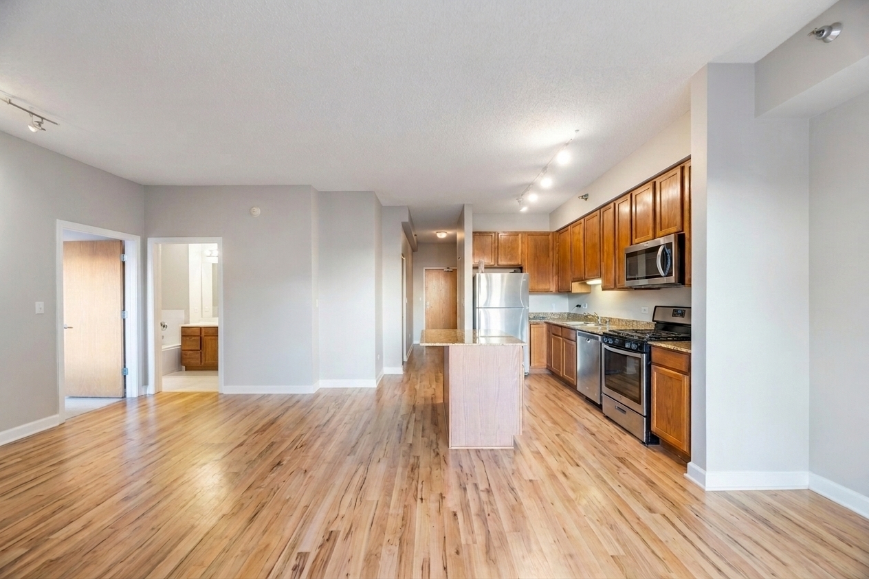 41 East 8th Street, Unit 1805 Chicago, IL 60605 - Photo 7 of 33 a view of a kitchen with wooden floor