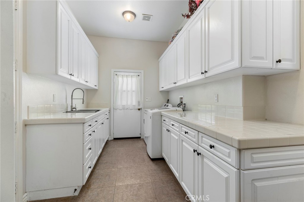 7907 Horizon View Drive Riverside, CA 92506 - Photo 37 of 58 Spacious laundry room with lots of storage space