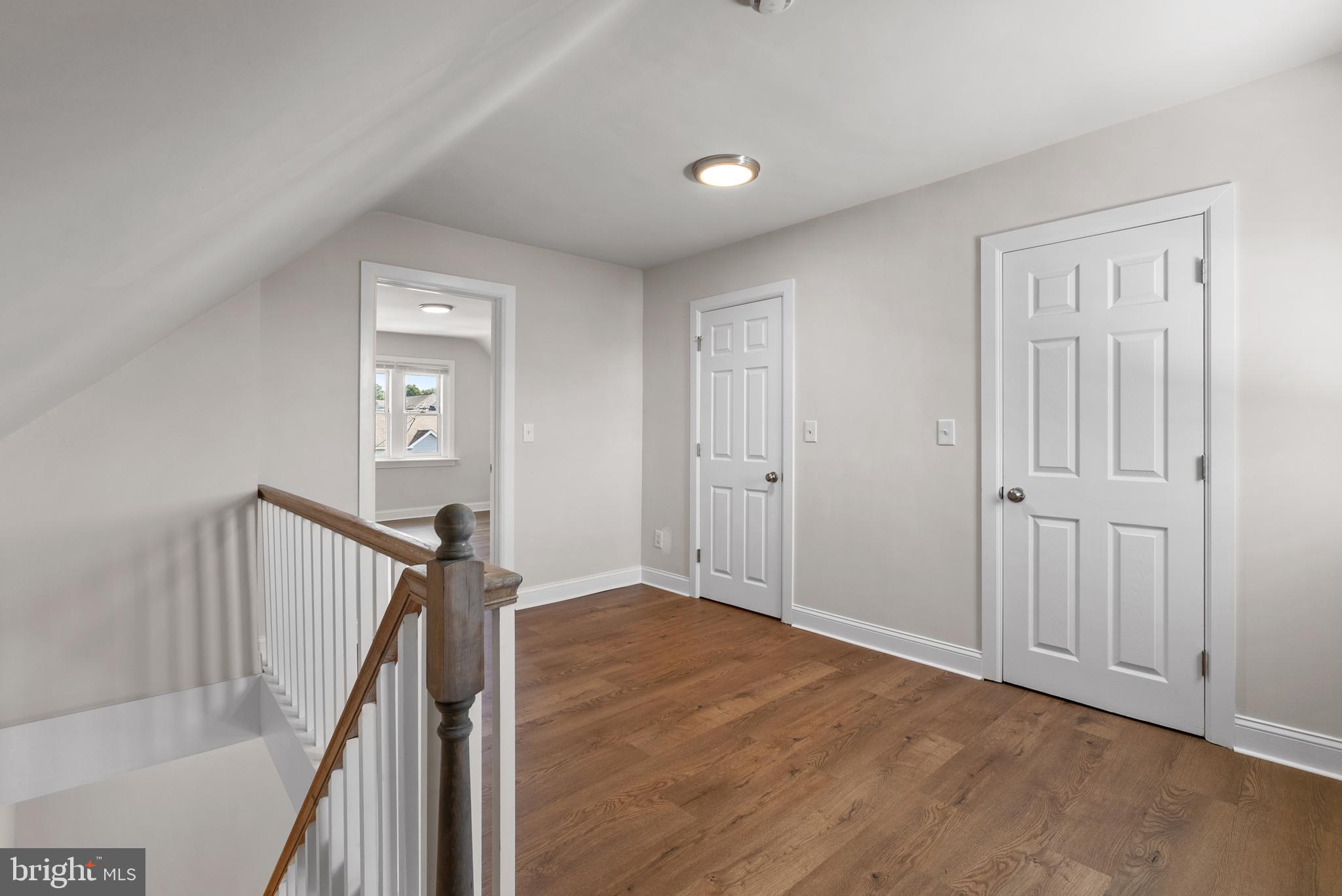48 Penn Avenue, Unit B UPSTAIRS Souderton, PA 18964 - Photo 12 of 16 a view of an empty room with wooden floor and stairs