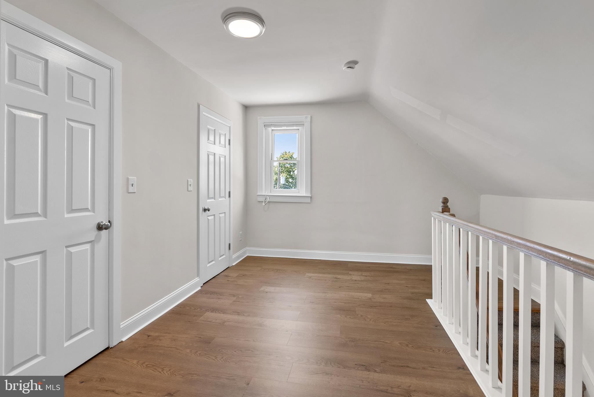 48 Penn Avenue, Unit B UPSTAIRS Souderton, PA 18964 - Photo 13 of 16 a view of an empty room with wooden floor and a window