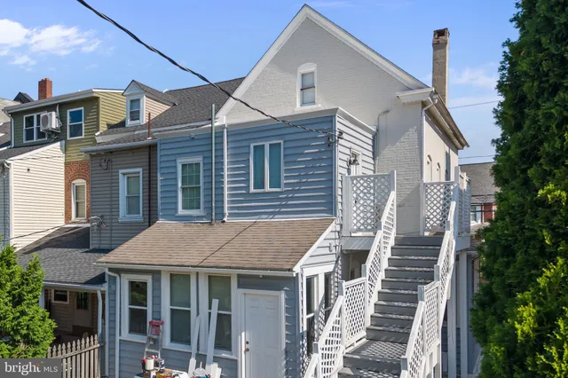 a aerial view of a house with a porch