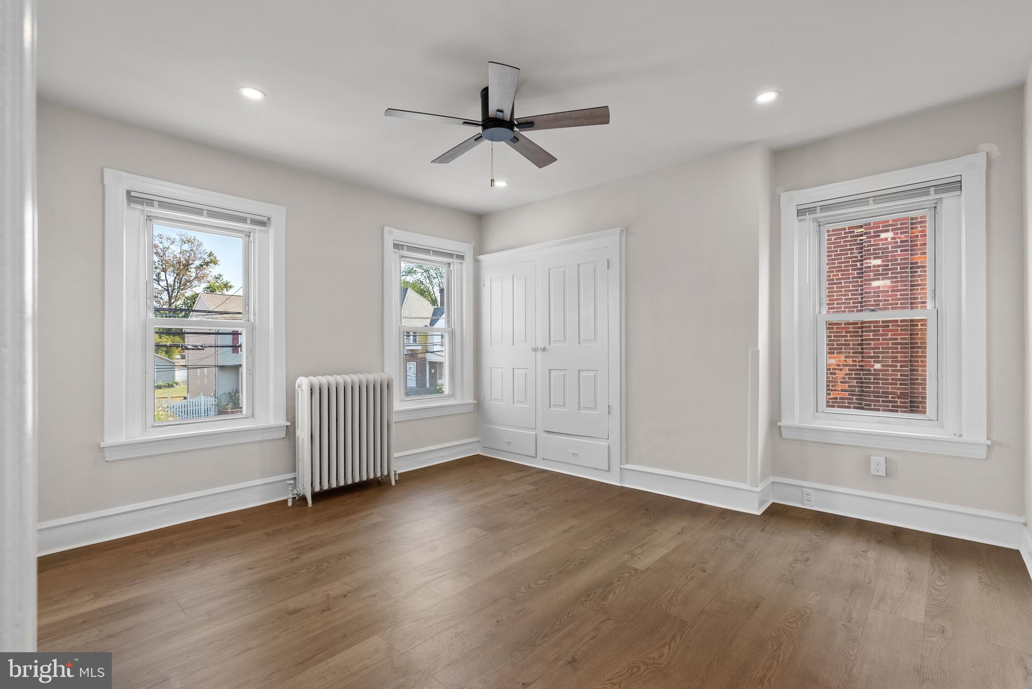 48 Penn Avenue, Unit B UPSTAIRS Souderton, PA 18964 - Photo 6 of 16 a view of an empty room with a window and wooden floor