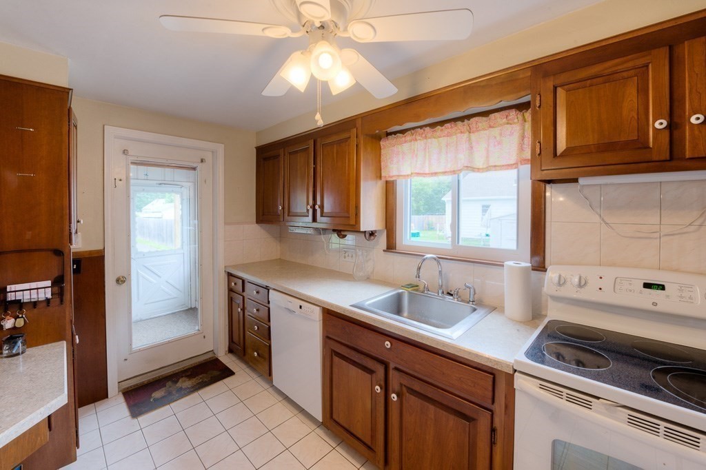 28 Cedar Street Three Rivers, MA 01080 - Photo 11 of 41 a kitchen with a sink and cabinets
