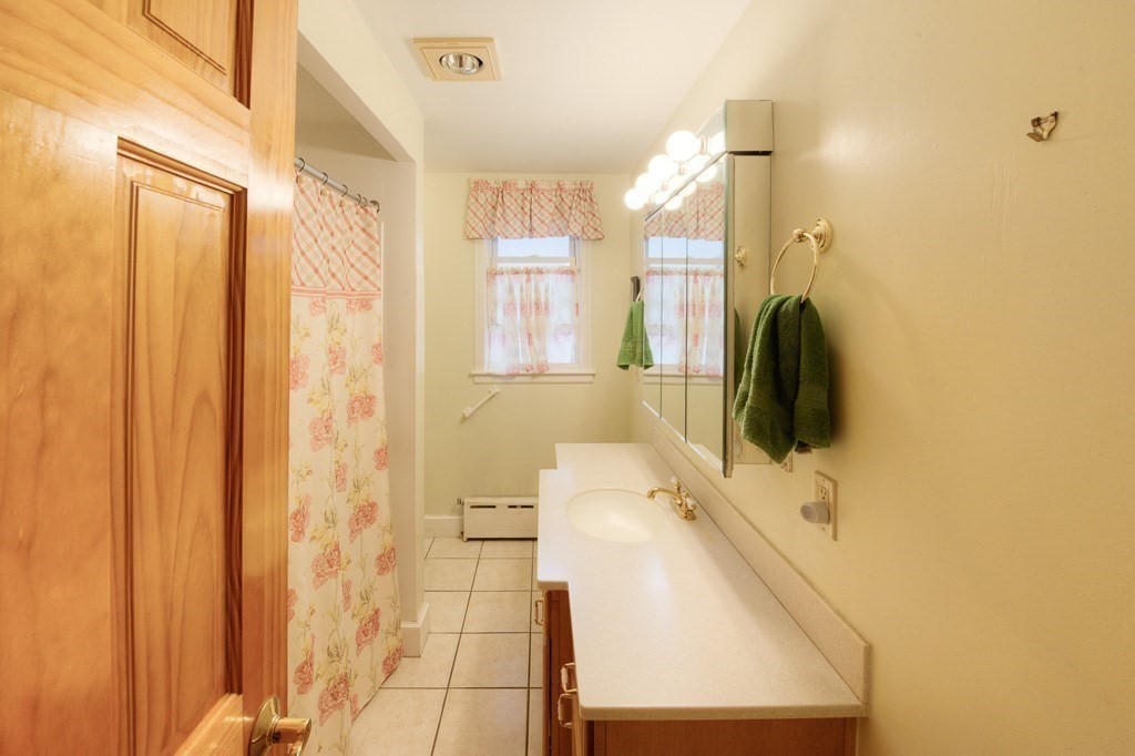28 Cedar Street Three Rivers, MA 01080 - Photo 14 of 41 a bathroom with a sink a mirror and a shower