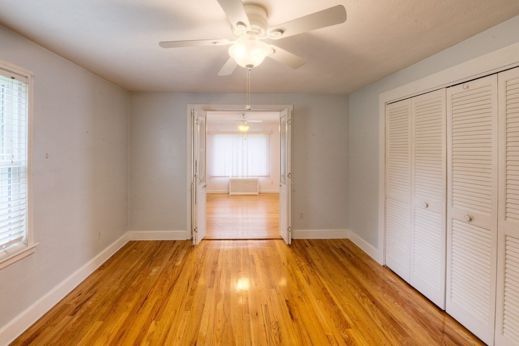 28 Cedar Street Three Rivers, MA 01080 - Photo 16 of 41 a view of a room with wooden floor and a ceiling fan