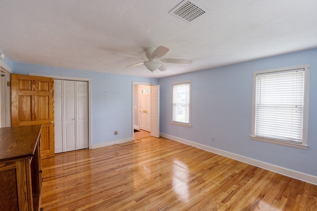 28 Cedar Street Three Rivers, MA 01080 - Photo 23 of 41 a view of an empty room with a window and wooden floor