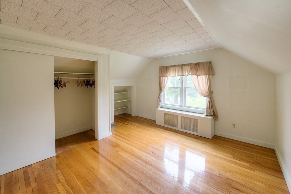 28 Cedar Street Three Rivers, MA 01080 - Photo 27 of 41 an empty room with wooden floor cabinet and windows