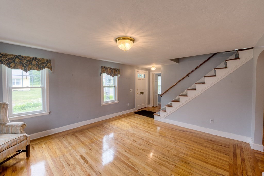 28 Cedar Street Three Rivers, MA 01080 - Photo 3 of 41 a view of an empty room with wooden floor and a window