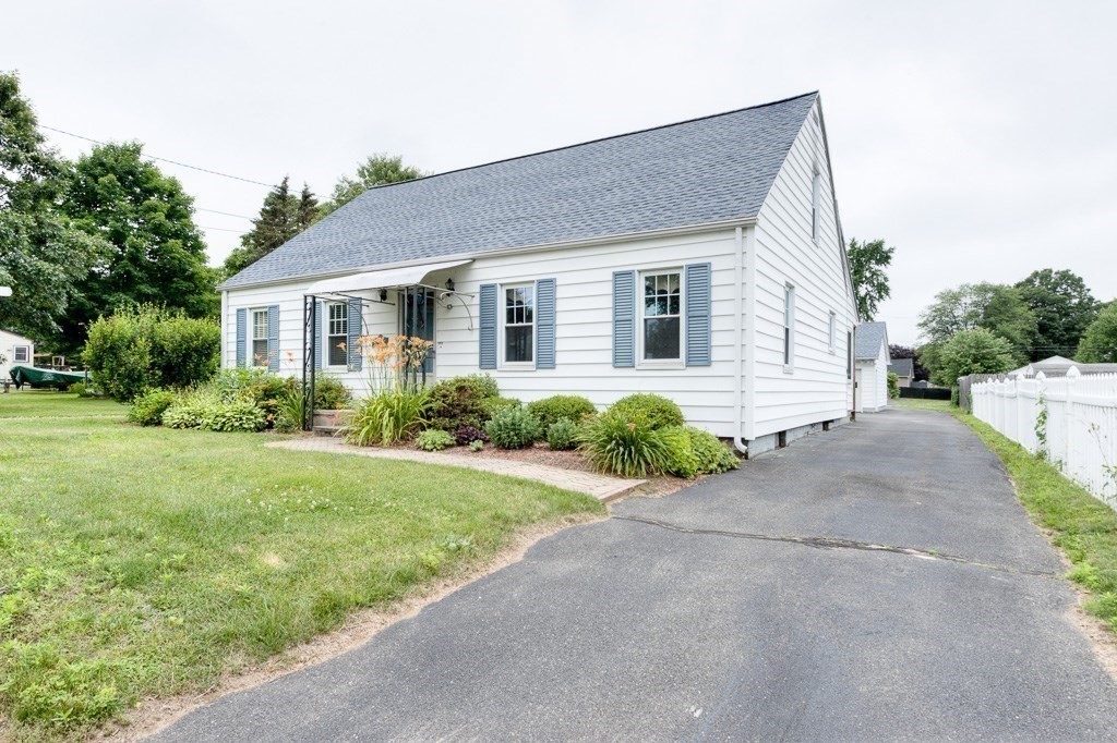 28 Cedar Street Three Rivers, MA 01080 - Photo 31 of 41 a front view of house with yard and green space