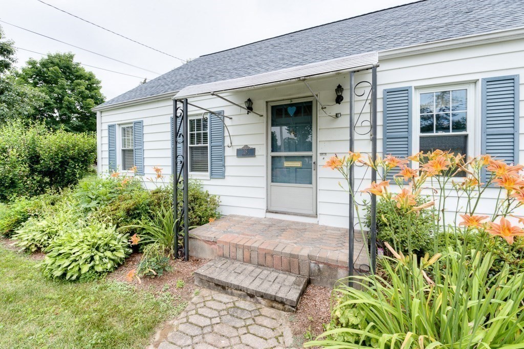 28 Cedar Street Three Rivers, MA 01080 - Photo 37 of 41 a front view of a house with garden