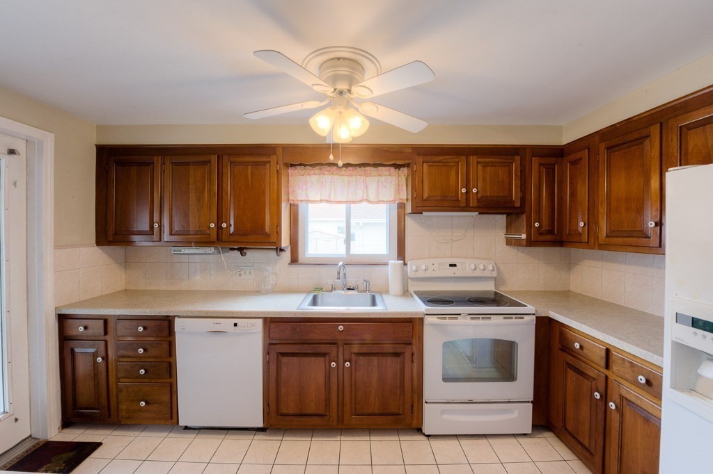 28 Cedar Street Three Rivers, MA 01080 - Photo 4 of 41 a kitchen with cabinets appliances a sink and a window