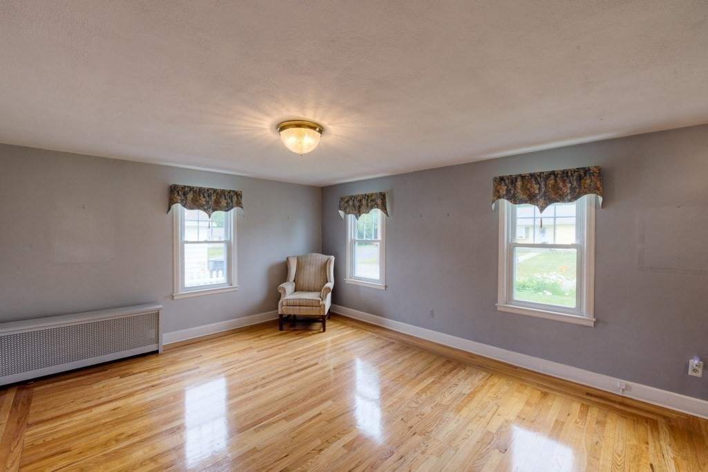 28 Cedar Street Three Rivers, MA 01080 - Photo 8 of 41 a living room with furniture and a window