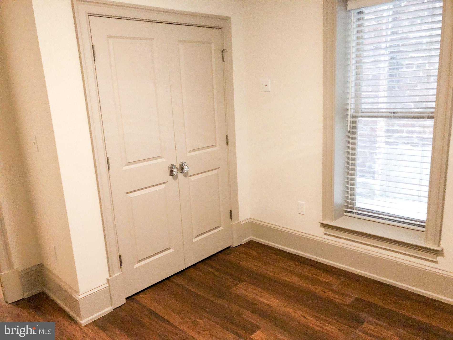 1302 East Capitol Street Northeast, Unit B Washington, DC 20003 - Photo 14 of 23 a view of a room with wooden floor and white walls