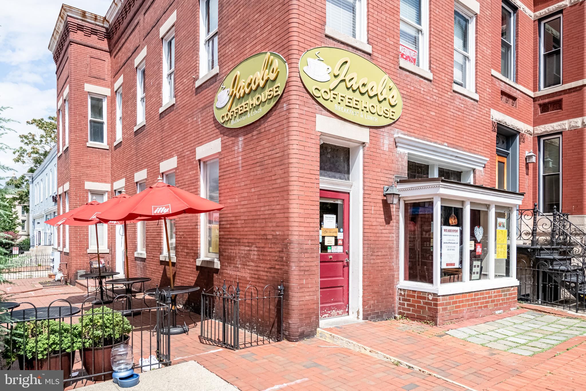 1302 East Capitol Street Northeast, Unit B Washington, DC 20003 - Photo 20 of 23 a view of a cafe with a table and chairs under an umbrella