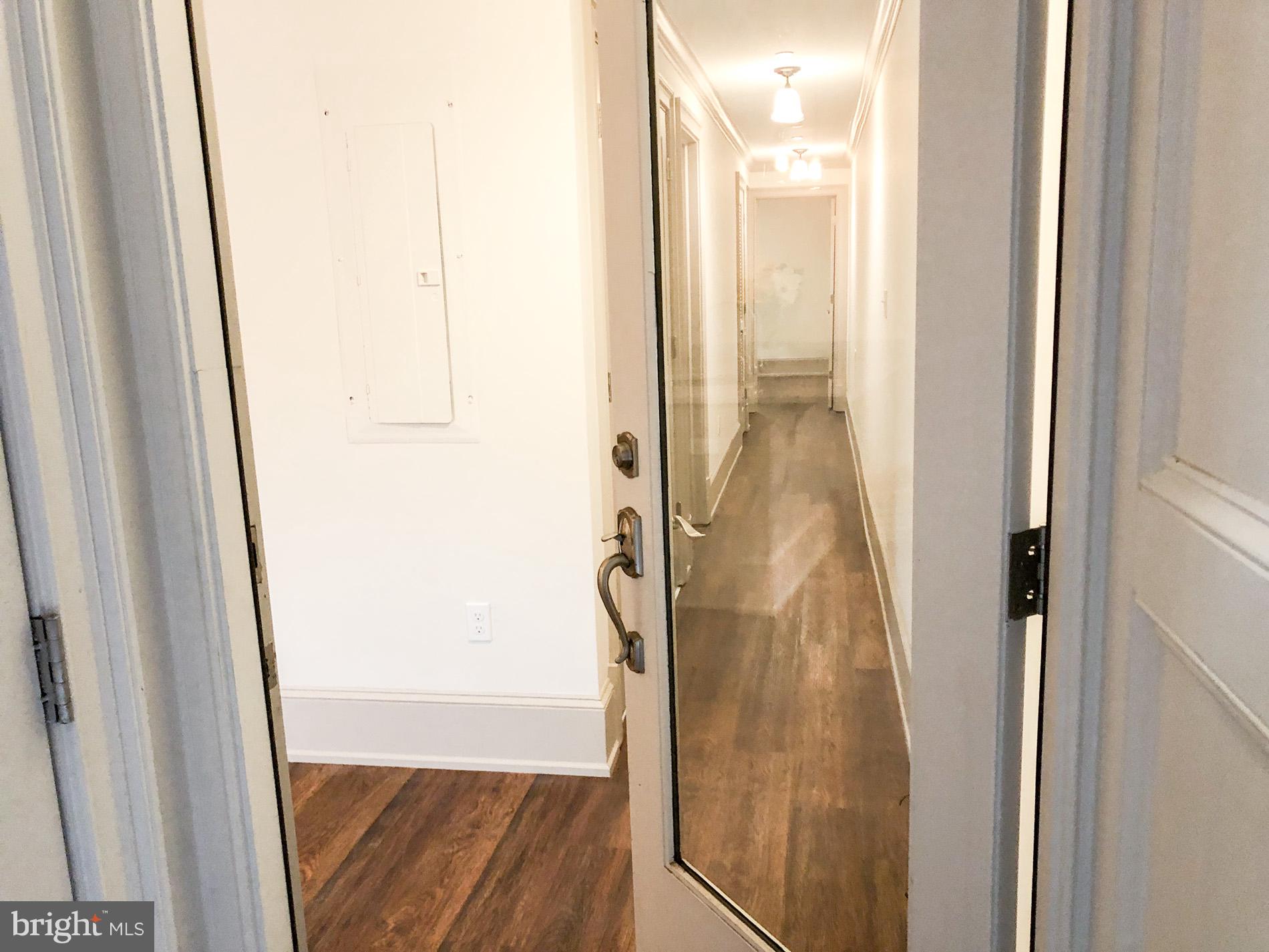 1302 East Capitol Street Northeast, Unit B Washington, DC 20003 - Photo 3 of 23 a bathroom with a glass shower door and mirror