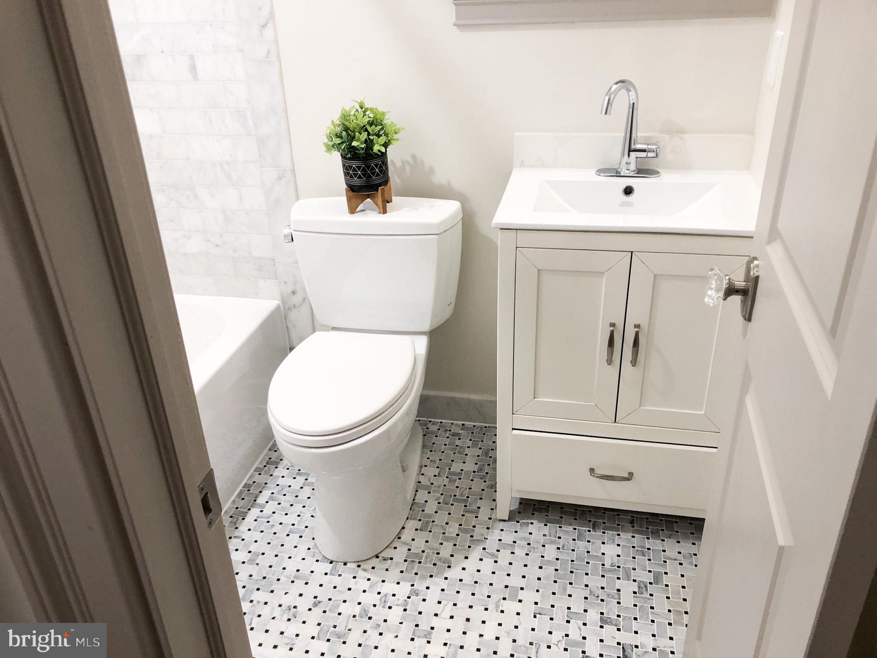 1302 East Capitol Street Northeast, Unit B Washington, DC 20003 - Photo 10 of 23 a bathroom with a toilet and a sink