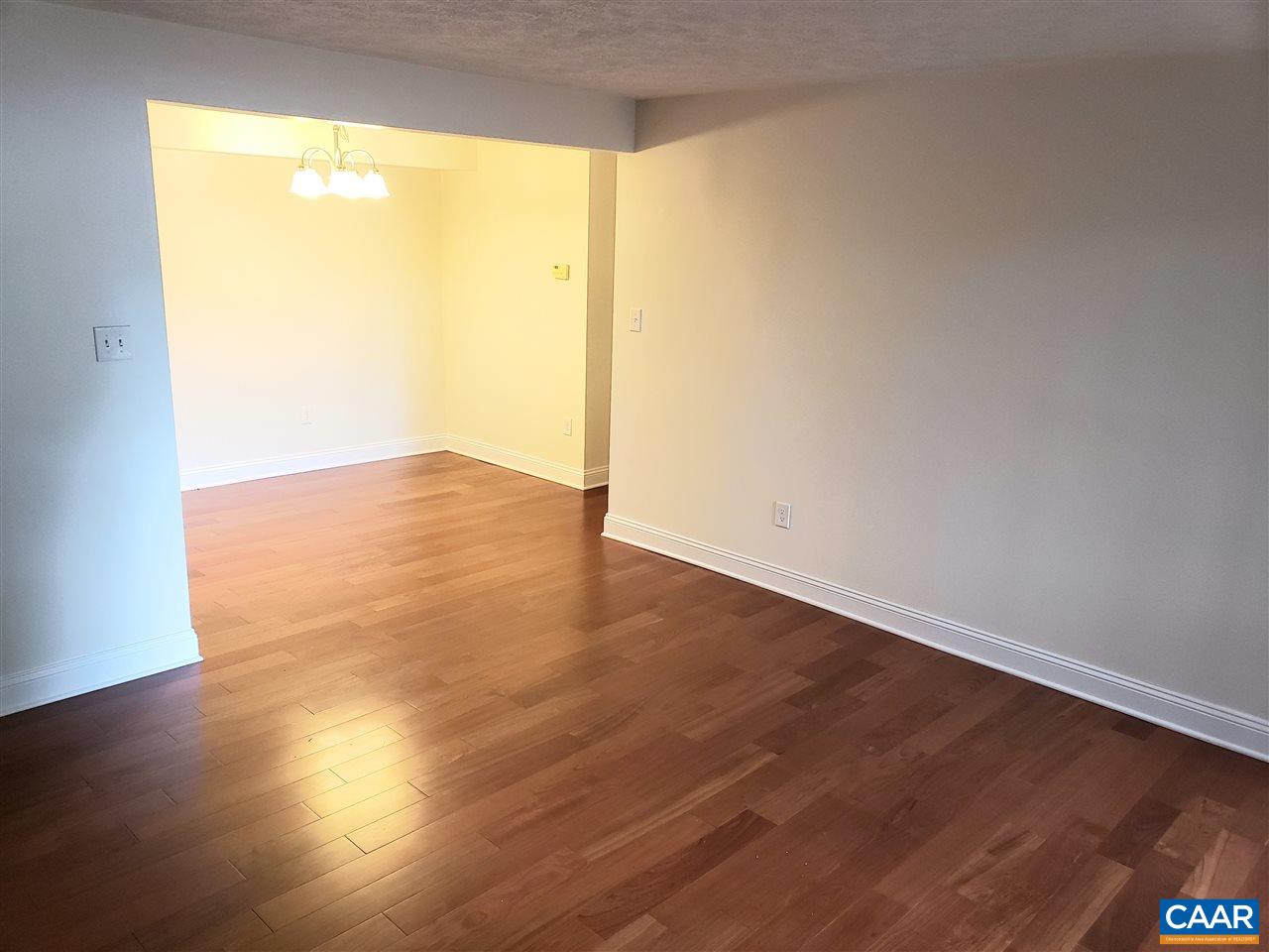 104 Turtle Creek Road, Unit 4 Charlottesville, VA 22901 - Photo 12 of 18 a view of empty room with wooden floor and fan