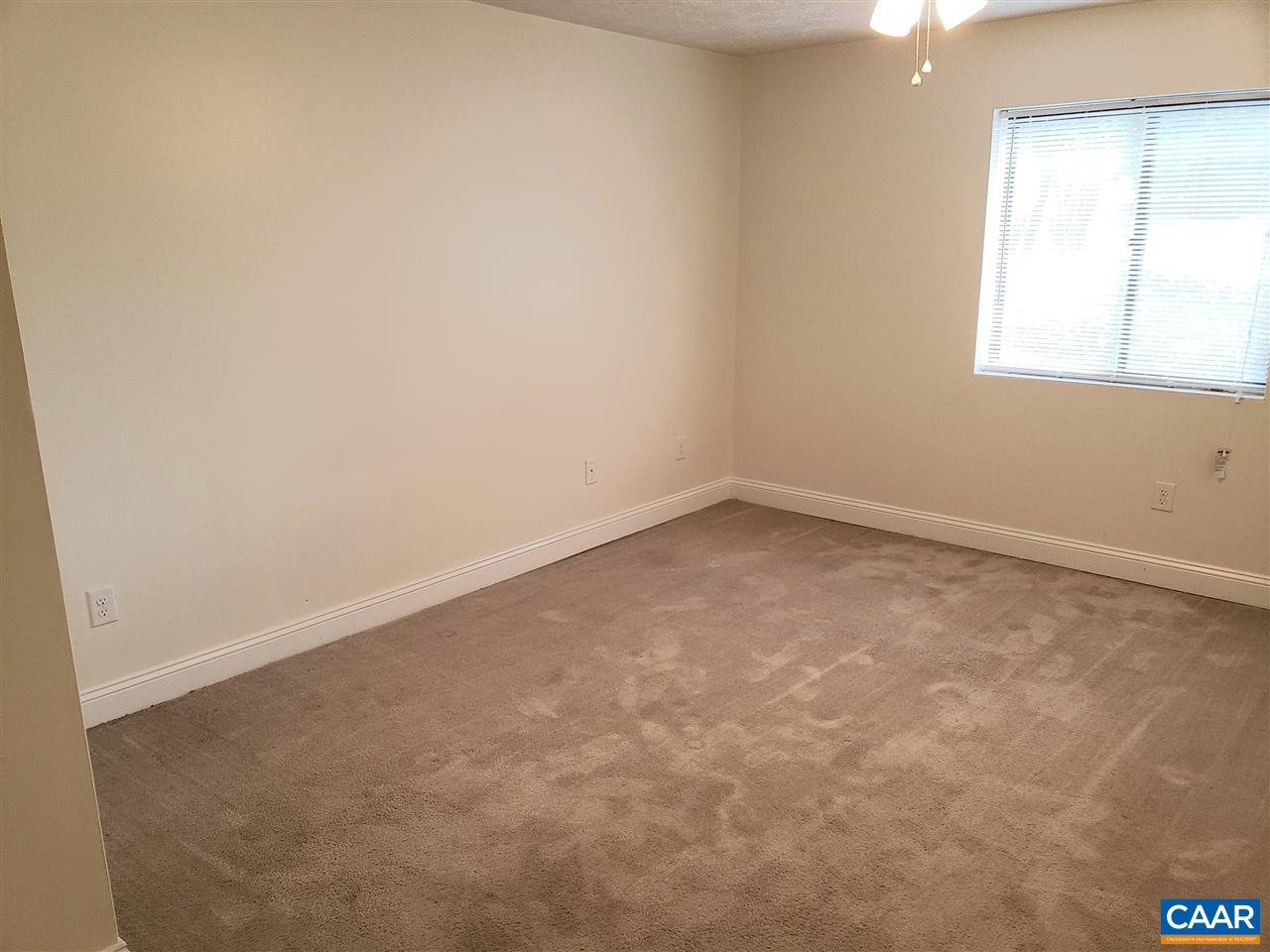 104 Turtle Creek Road, Unit 4 Charlottesville, VA 22901 - Photo 5 of 18 an empty room with a window