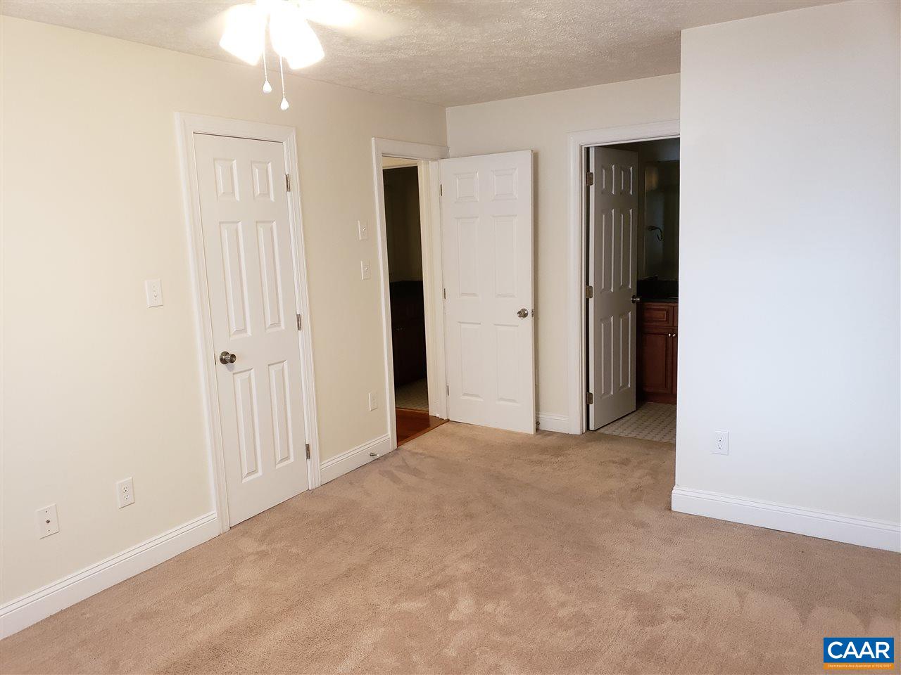 104 Turtle Creek Road, Unit 4 Charlottesville, VA 22901 - Photo 10 of 18 an empty room with windows and closet
