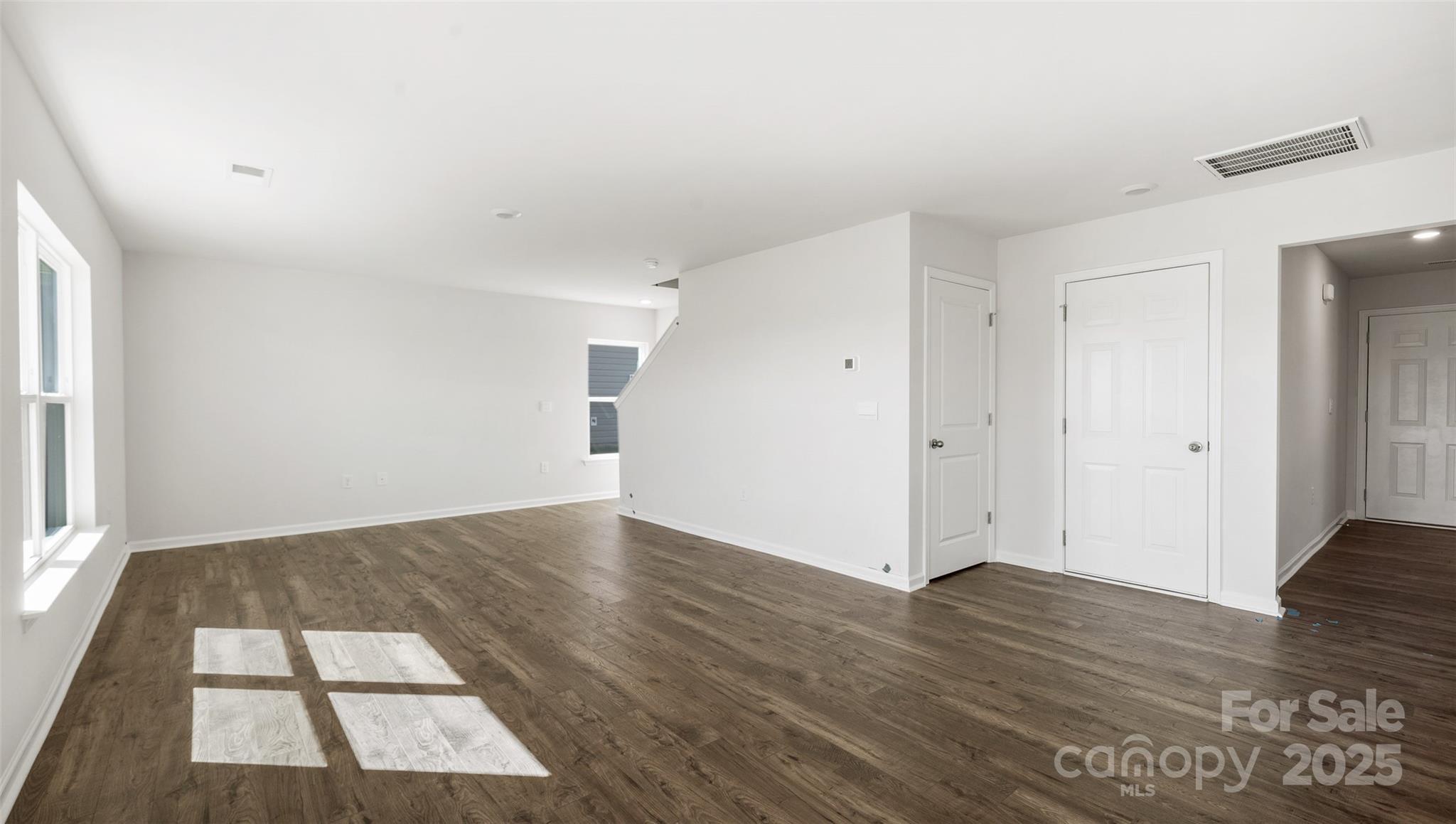 143 Callie River Clyde, NC 28721 - Photo 12 of 20 an empty room with wooden floor and window