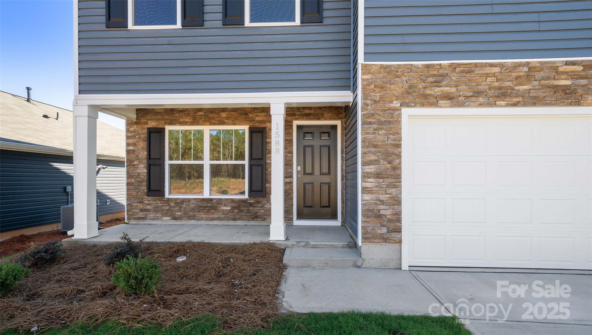 143 Callie River Clyde, NC 28721 - Photo 3 of 20 a front view of a house with a yard